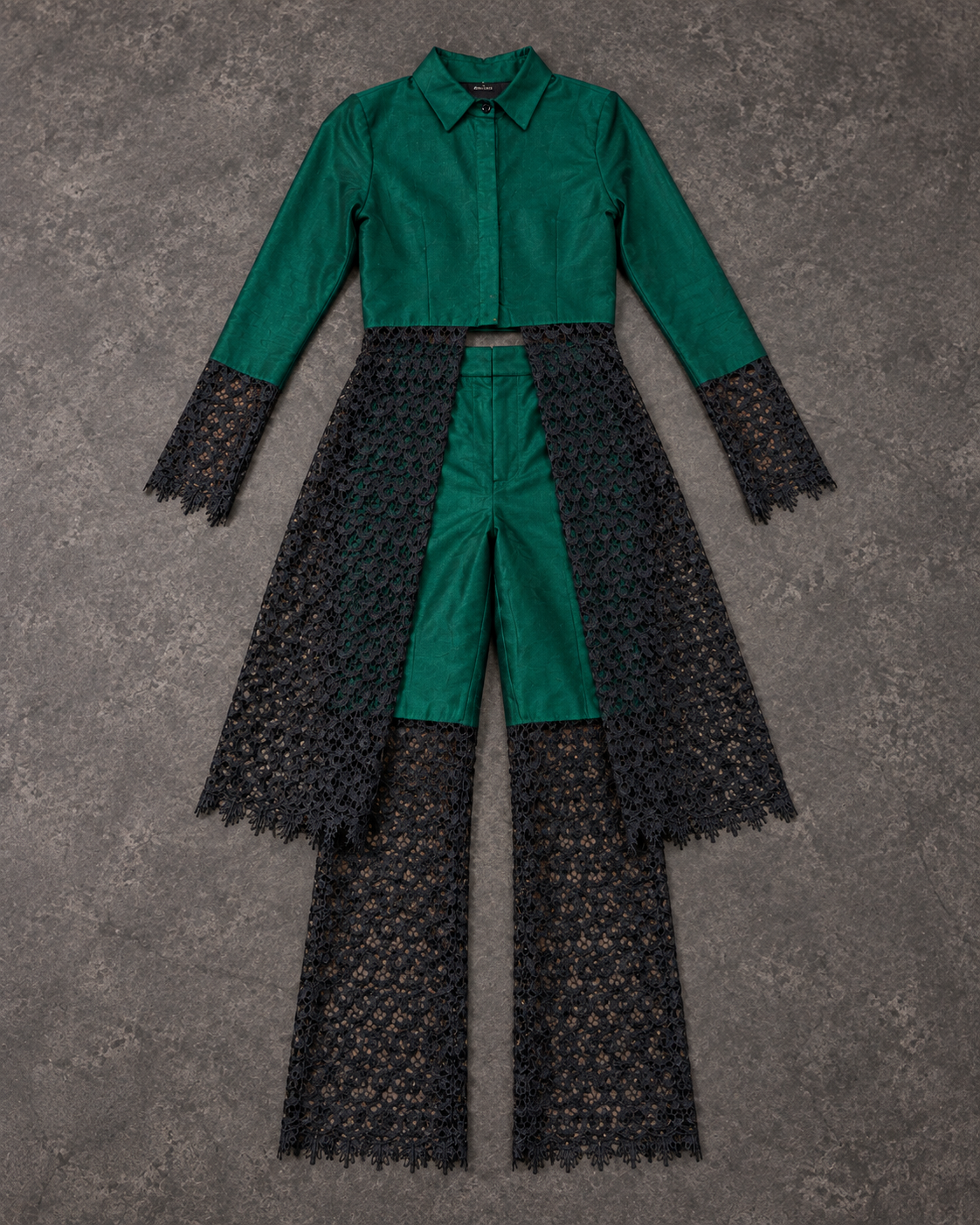 Flat lay of the emerald shantung shirt with lace skirt and lace flared trousers