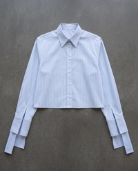 Flat lay of the cropped pinstripe shirt with long tie cuffs