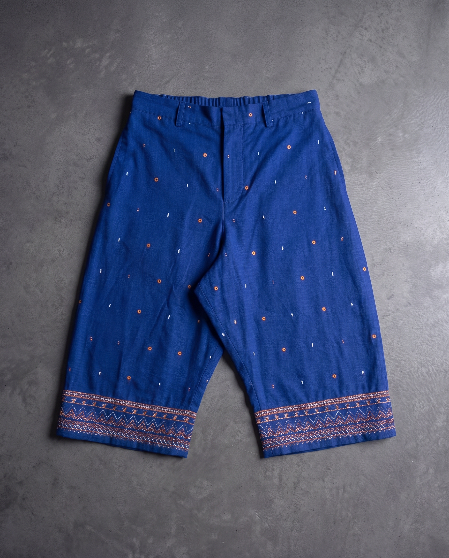 Cobalt drop crotch pant flat lay with embroidered cuffs