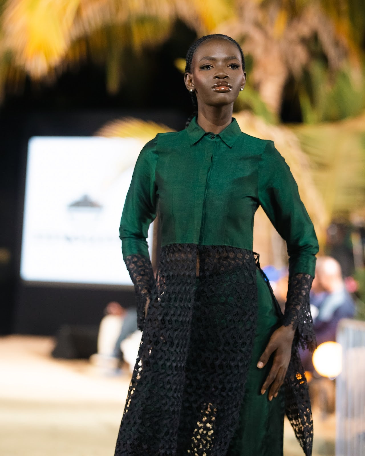 Close view of the emerald shantung shirt and black lace skirt on the Harmattan '25 runway