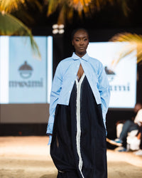 Cropped pinstripe shirt worn open on the Harmattan '25 runway