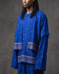 Short sleeve shirt layered over long sleeve overshirt, cobalt with copper and white embroidered dots